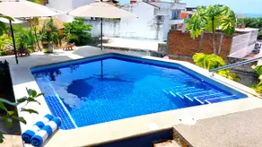 Curiel's Retreat 2BR, Private Terrace, Heated Pool, Walk to Malecón & Beach - Image 4