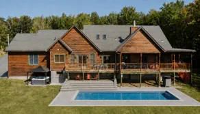9BR Log Cabin Home w/ Hot Tub & Swimmable Pond - Image 4