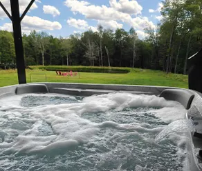 9BR Log Cabin Home w/ Hot Tub & Swimmable Pond - Image 2