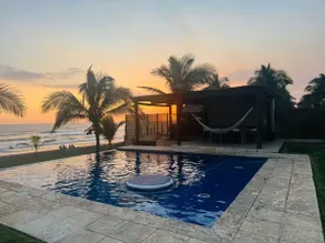 Beachfront Retreat with Infinity Pool & Sunsets - Image 4