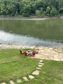 Riverfront getaway with steps to fishing paradise. - Image 4