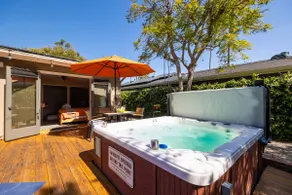 3BR Urban Oasis with Hot Tub, Pool & Private Deck - Image 3