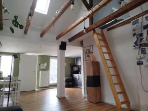 Renovated apartment above the rooftops of the city - Image 3
