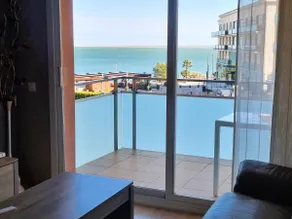 An apartment with a sea view, a swimming pool and parking. - Image 4
