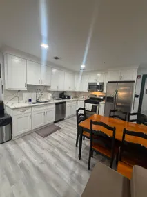 Spacious 2BR Suite with Balcony | Modern Comfort - Image 5