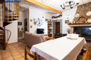 A townhouse with a picnic area and fireplace. - Image 4