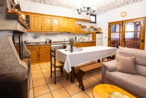 A townhouse with a picnic area and fireplace. - Image 3