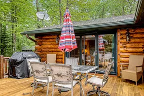 Lakefront Log Cabin with Sunset Views and Dock - Image 2