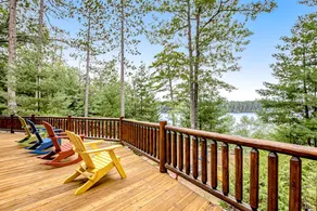 Lakefront Log Cabin with Sunset Views and Dock - Image 3