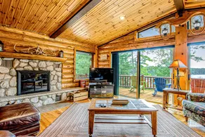 Lakefront Log Cabin with Sunset Views and Dock - Image 5