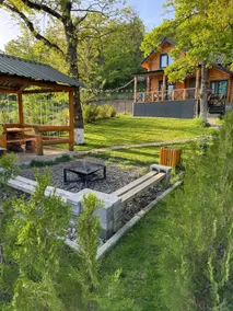 A cozy house in Kikiti with a fireplace and a beautiful yard. - Image 2