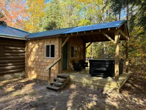 Two bedroom cabin with hot tub and fireplace. - Image 3