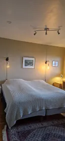 Bedroom, living room, bathroom, refrigerator, microwave, outdoor area. - Image 2