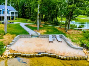 250’ of Lakefront with Boat House & Private Beach - Image 3