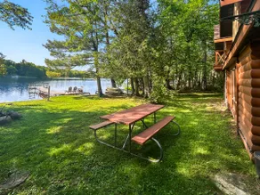 Lakefront 3BR, 2BA cabin with dock, boat, firepit - Image 4