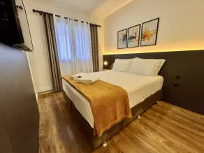 1-Bedroom Premium Batel · Sky · Air Conditioning and Pool - Image 5