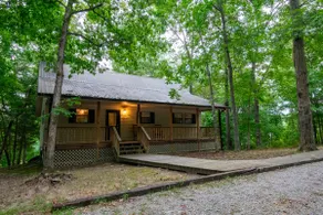 Luxurious cabin with fire pit, kayaks, and dock. - Image 2