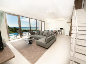 Blue Rela Luxe Resort Okinawa, a villa with a pool surrounded by nature - Image 3
