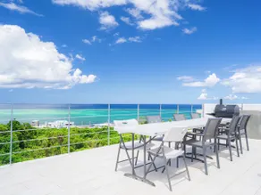 Blue Rela Luxe Resort Okinawa, a villa with a pool surrounded by nature - Image 4