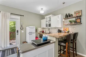 Private one-bedroom unit with living space. - Image 2