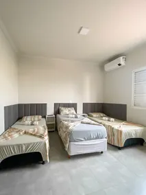 Pôr Do Sol Varginha Guesthouse, Triple Suite - Image 2