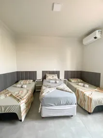 Pôr Do Sol Varginha Guesthouse, Triple Suite - Image 5