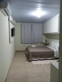 Air-conditioned guesthouse in Santos, Room with a bed. - Image 4