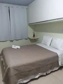 Air-conditioned guesthouse in Santos, Room with a bed. - Image 2