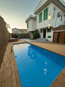 Villa with Green Shutters and Garden - Image 2