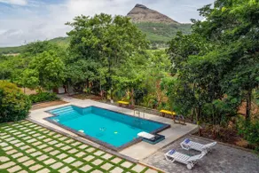 StayVista at Amber & Mist - Pool and Lawn - Image 2
