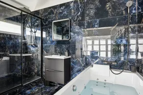 Elegant Jacuzzi Suite • Black & Blue Decor • Sleeps 2 - Image 2