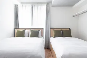 Sumyca Tokyo's Apartment 1, Apartment with a double bed and a single bed. - Image 2