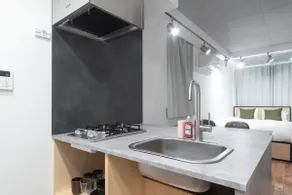 Sumyca Tokyo's Apartment 1, Apartment with a double bed and a single bed. - Image 4