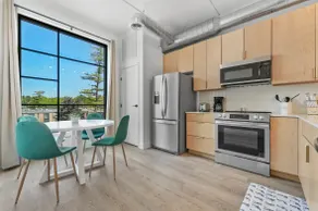 E. Side Condo w/ Rooftop Hot Tub - Image 2