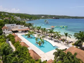 Sunset at ArecaHomes Beach Access Pool and Water Park - Image 3