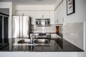 Take in Panoramic City Views from a Sophisticated Condominium - Image 4