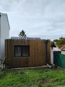 Bedroom with shower, toilet, fridge, microwave on the ground floor. - Image 3