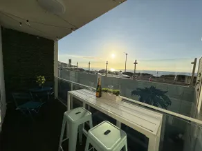 Sandy Beach Getaway w/ Balcony, Pool, & Parking - Image 3