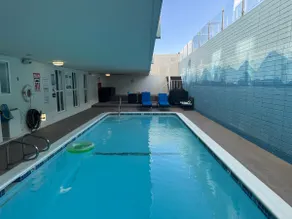 Sandy Beach Getaway w/ Balcony, Pool, & Parking - Image 5
