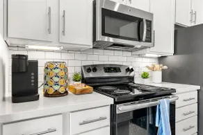 Modern 2BR near Airport & DWTN | Patio | Pool/Gym - Image 2