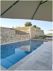 Veduta Ta Pinu Apartments with Stunning Views Garden Sauna Pool and Gym - Image 3