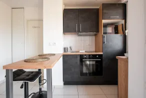 2-room apartment balcony with secure and free parking - Image 2