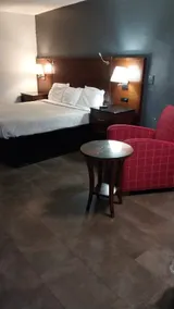 (120) Fenced King Bed Hotel Room - Image 2