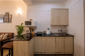 Elegant 1BHK Apartment w/ Common Sitting Area - Image 3