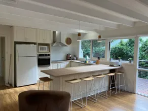 Secluded beach cottage surrounded by trees - Image 5