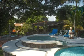 A villa with a swimming pool, jacuzzi, tennis court, and squash - Image 4