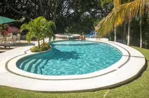 A villa with a swimming pool, jacuzzi, tennis court, and squash - Image 5