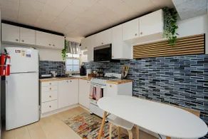 Beach Block 2-Bed with Coastal Palm Trees and Yard - Image 3