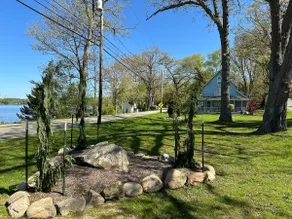 Private lakeside patio with firepit & dock. - Image 3
