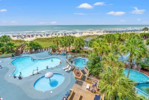 Gorgeous clean oceanfront condo- Pools, hot tubs, pool bar, lazy river! - Image 2